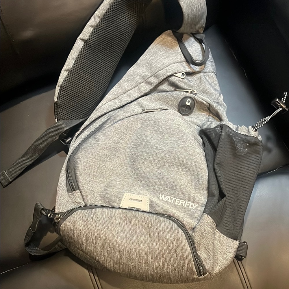 Gray Backpack with Textured Fabric and Sporty Design